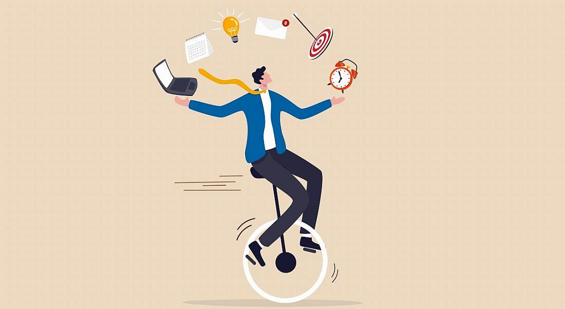 An illustration of a man on a unicycle juggling symbols representing different work tasks.