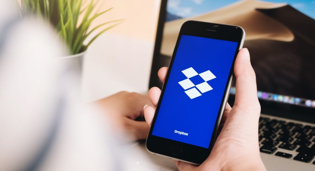 A close up of the Dropbox logo on a smartphone.