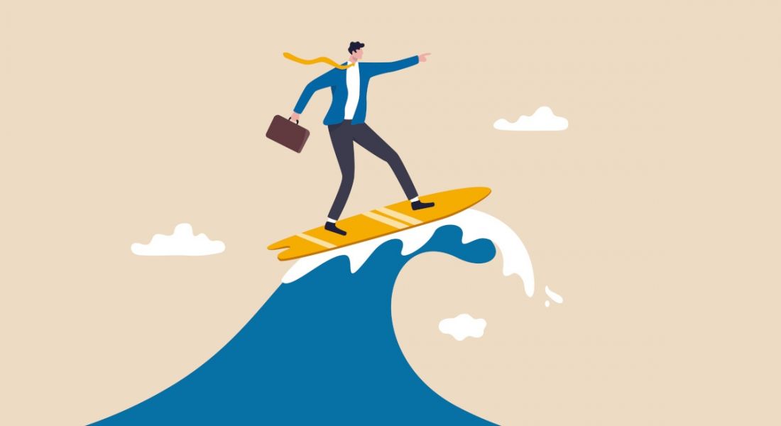 Cartoon showing a worker surfing the crest of a wave on a surfboard.