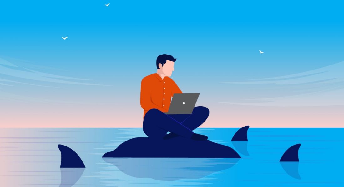 Cartoon of a worker as an insider threat sitting on a rock using a laptop as sharks representing cybercriminals circle around him.