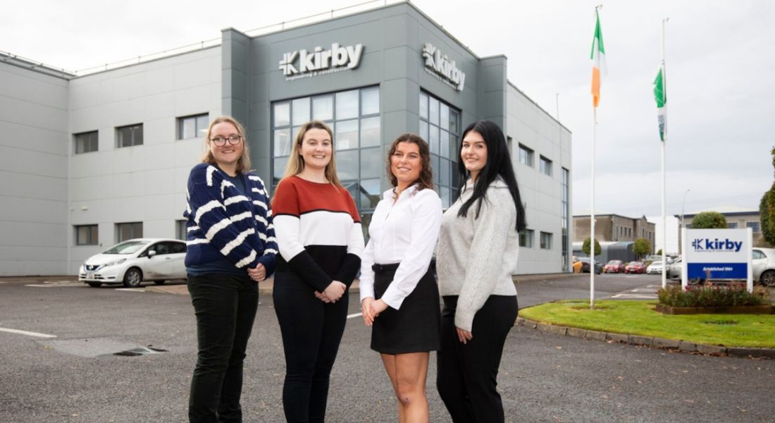 Four women standing outside the headquarters of Kirby Group engineering in Limerick.