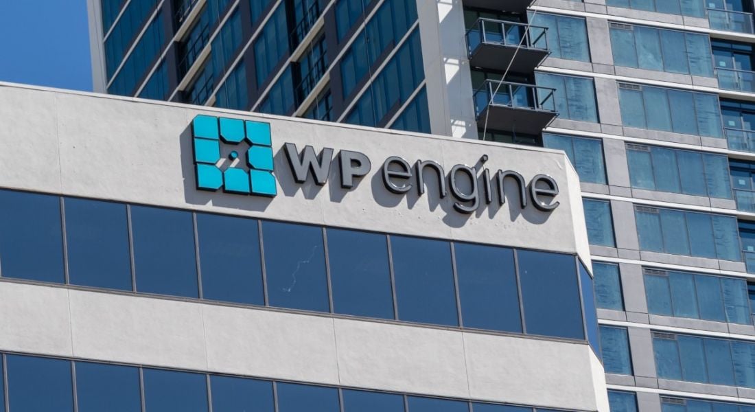 A building with the WP Engine logo on top on a sunny day.