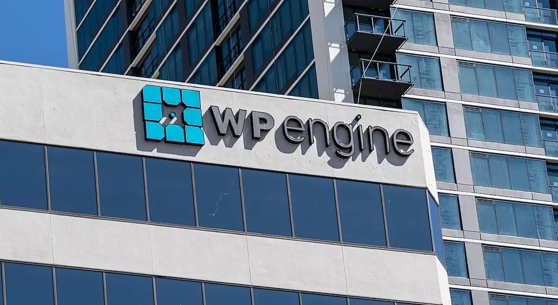 A building with the WP Engine logo on top on a sunny day.