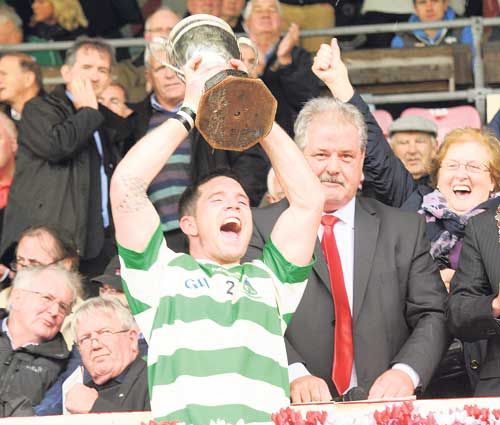 The moment of truth: Valley Rovers captain Noel ODonovan lifts the cup after his sides victory over Na Piarsaigh in the county PIFC final at Páirc Uí Chaoimh.       