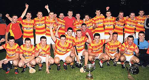 The wait is over: The Newcestown team celebrates after defeating Diarmuid Ó Mathúnas in the Kinetica junior A hurling championship final at Bandon.