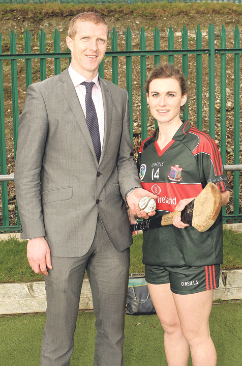 A helping hand: Cork and Barryroe camogie player and captain of Sacred Heart Secondary School Claire Sexton gets a briefing from Kilkenny hurling great Henry Shefflin before the big game against St Marys High School in the Munster colleges senior camogi