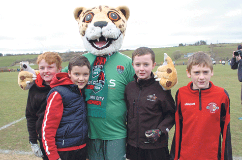 Fan-tastic! Skibbereen U12 players Darragh Coombes, Niall Sweetnam, Fiachra Collins and Andrew Caverley with Cork City mascot, Corky, before Skibbereen AFC played Cork City in the Dave Wigginton Memorial Cup last Saturday afternoon.        