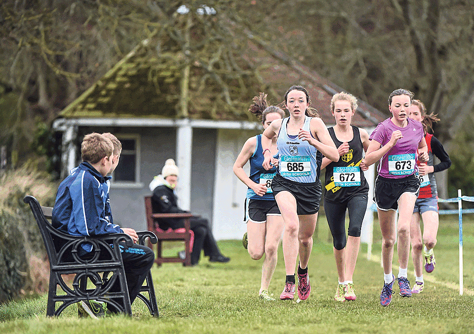 In the fast lane: Caoimhe Harrington, Coláiste Pobail Bheanntrai, left, leads the opening lap of the intermediate girls race, on her way to a fantastic overall win, during the GloHealth All-Ireland Schools Cross-Country Championships at Clongowes Wood C