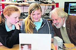 David Puttnam talks technology with Cappabue pupils Hannah Campbell and Bonnie Dale