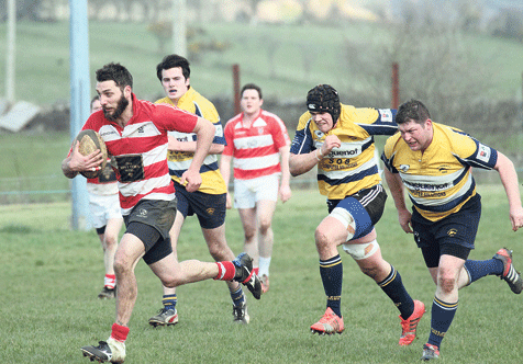 Hat-trick hero: Skibbereen winger Denis ODriscoll sprints clear to score the second of his three tries in this Munster Junior Plate Cup match against Dolphin RFC at the Showgrounds on Sunday.