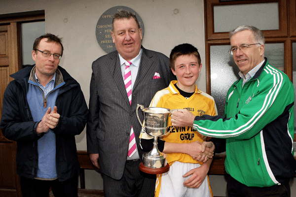Brian Herlihy (right) presents the Dr Michael Herlihy Memorial Cup to Darrara O