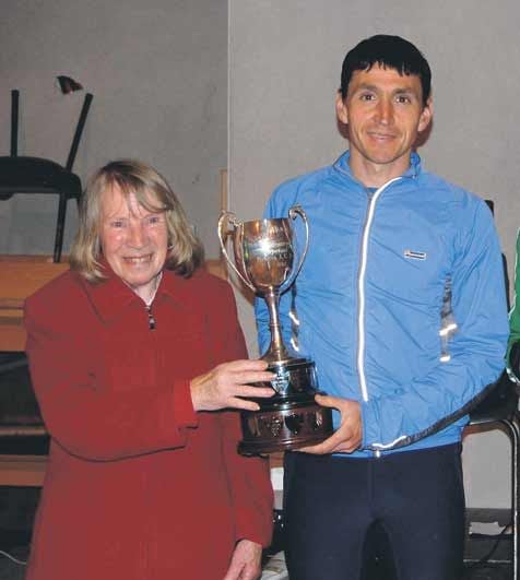 Presentation: Alan OShea, winner of the Midleton five-mile road race, receives the Joe Hourigan Memorial Trophy from Angela Hourigan. 