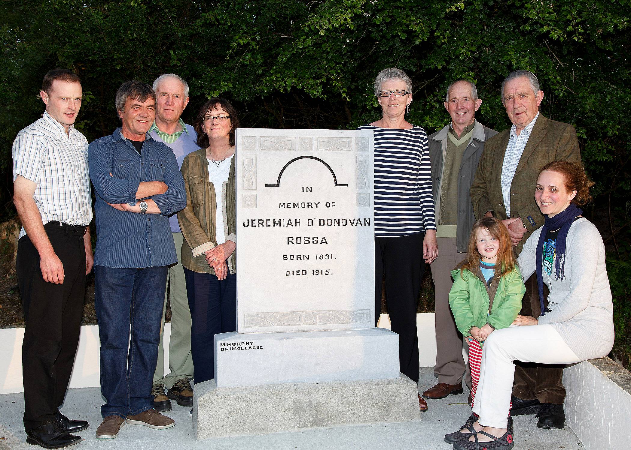 The committee at the newly restored monument