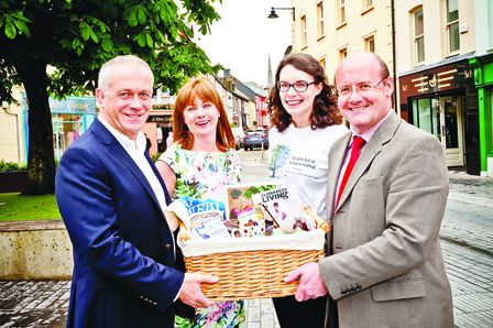 Noel Lawlor (left) and Sinead OCrowley, Clonakilty Chamber of Commerce together with Random Acts of Kindness (RAOK) Festival organiser Theresa OLeary, present a gift of the towns produce and crafts to Jason Field of Skibbereen and District Chamber to m