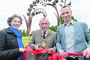 Suzanne Lyle, Arts Council of Northern Ireland, with Lord Mayor of Belfast, Cllr Arder Carson, and artist Alex Pentek at the Forget Me Not sculpture.