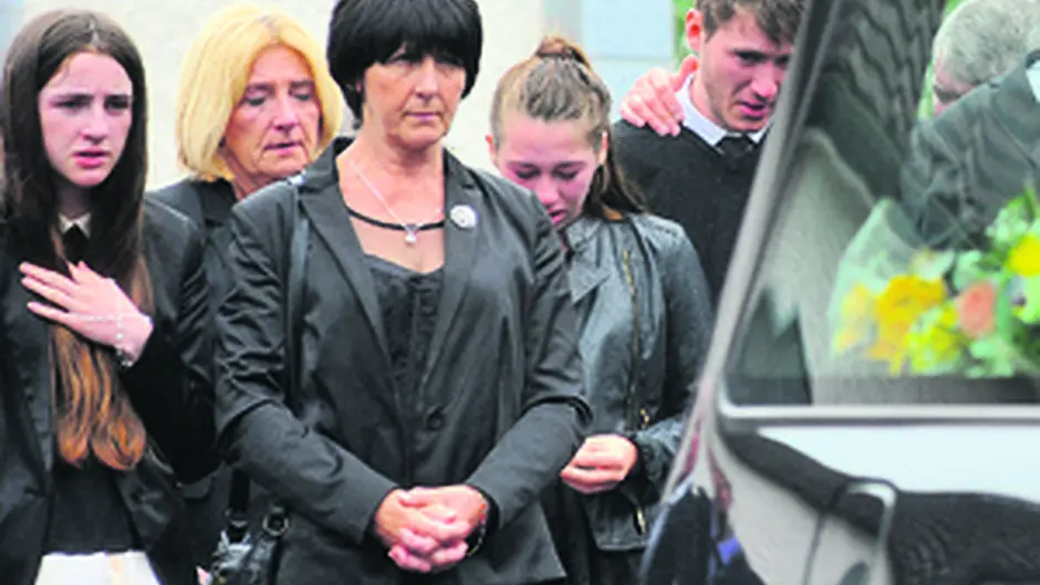 Ann Davis (third from left) chief mourner at the funeral, at the Sacred Heart Church in Rath, Baltimore, on Monday Image