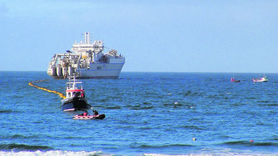 High speed 200m fibre optic cable comes ashore at Garretstown beach Image