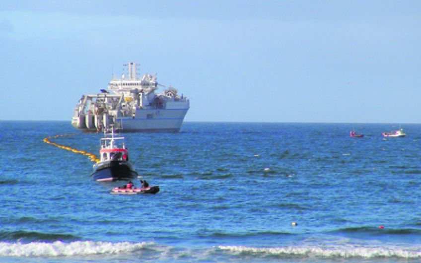 High speed 200m fibre optic cable comes ashore at Garretstown beach Image