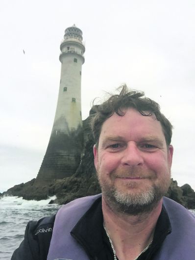 Simon's big adventure as he rows to Fastnet in his father's oarste Image