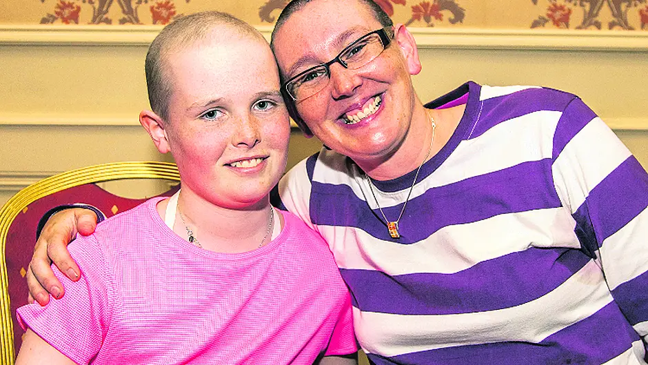 Aoife's coach shaves head in solidarity Image