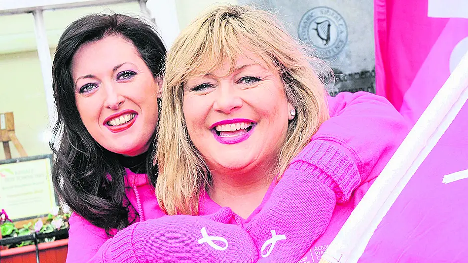 Getting ready for the pink ribbon walk Image