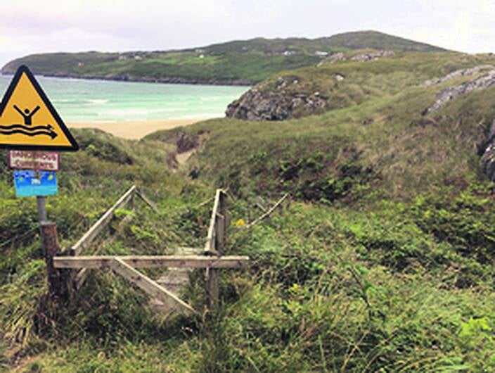 Dispute over beach access sees barbed wire coming and going Image