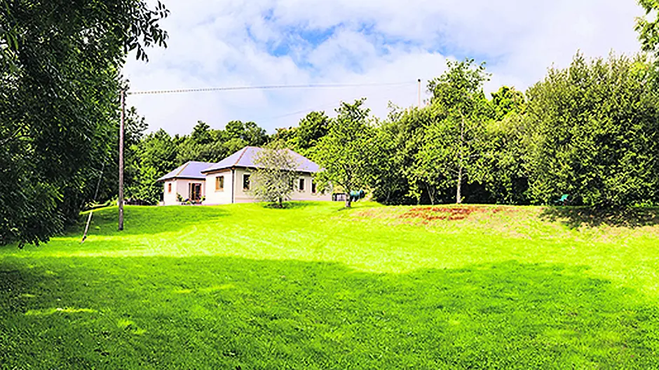 A river runs through it and a veranda wraps around this ‘gem' Image