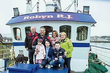 Skipper celebrating clean bill of health with trawler Robyn Image