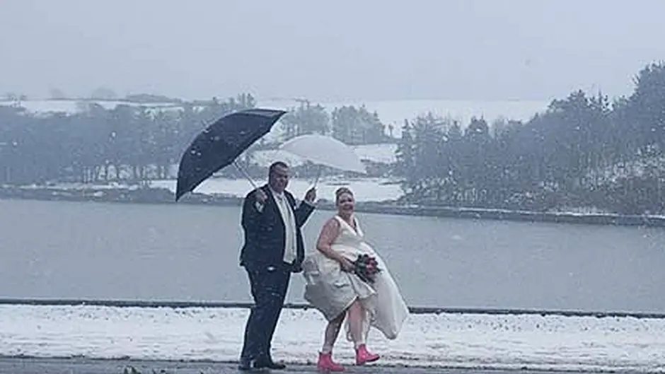 A case of all white on the day as four weddings go ahead despite weather Image