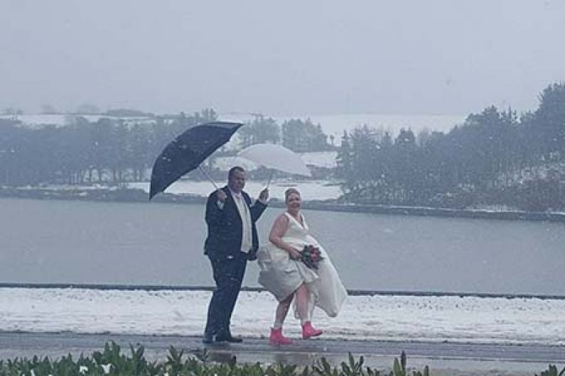 A case of all white on the day as four weddings go ahead despite weather Image