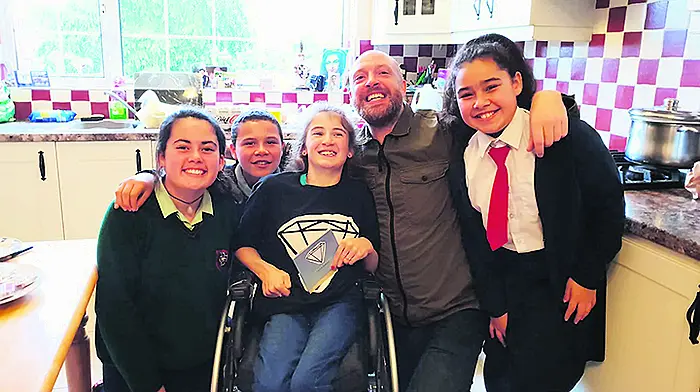 Singer Brian's good deed-y for his number one fan Jennifer Image