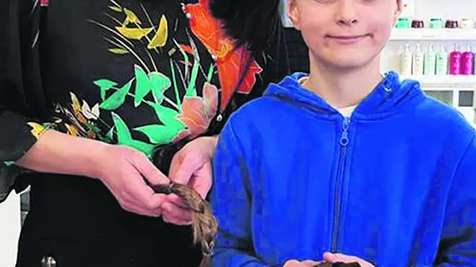 Alex donates hair to charity for kids' wigs Image