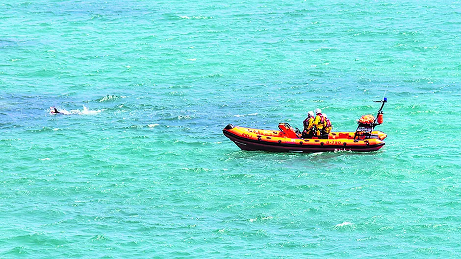 RNLI escorts swimmer back to shore Image