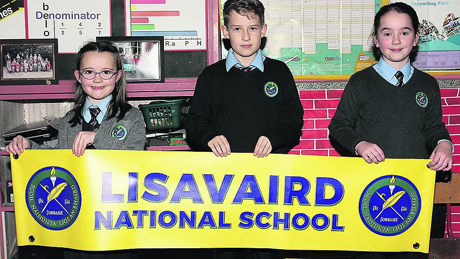 School's crest reflects village's history Image