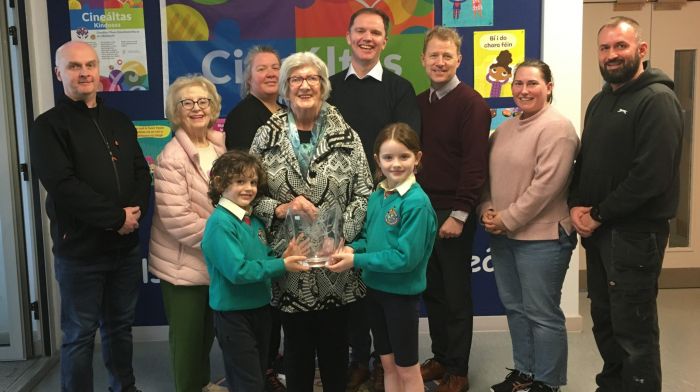 The Gaelscoil Mhichíl Uí Choileáin entry in the Clonakilty St Patrick’s Day parade won first prize of €200 and was presented with the Pauline Lowney perpetual memorial trophy by parade committee members and relatives of the late Pauline. Front (centre) Nan Dineen (sister of Pauline) and vice chairperson of the parade committee, presenting the trophy to pupils JT and Zoë Lowney, who are grandchildren of the late Pauline Lowney. Also included (from left): Alan Lowney, Mary O’Donovan, Aileen Harte (parade committee), Conor Lowney, Pádraig Ó hEachthairn, Kate O’Sullivan (parade committee) and Michal Fujdiar (school caretaker), who spent many hours making props for the winning parade entry.