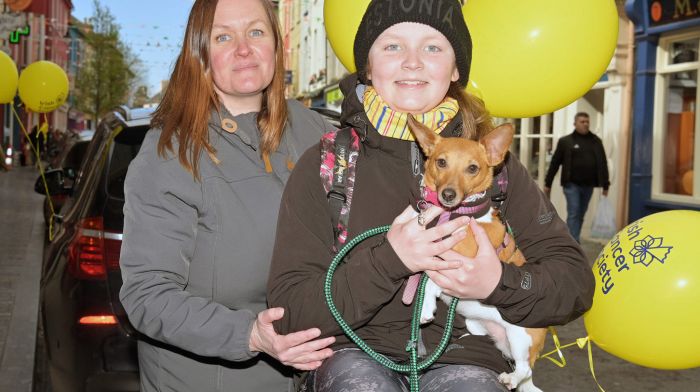 Locals Heleri (left) and Clíodhna Allis with their Jack Russell Pip in Pearse Street, Clonakilty.    (Photo: Martin Walsh)