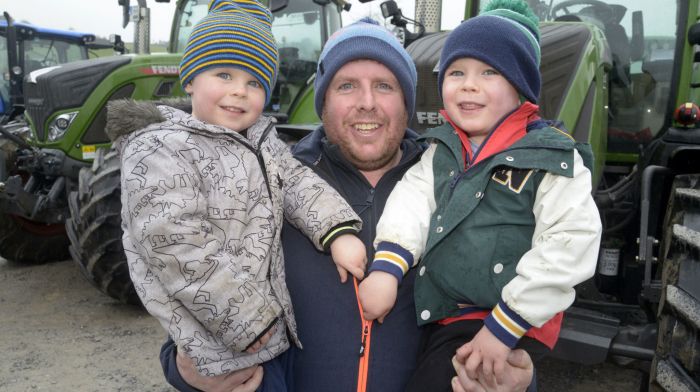 Sean Murray from Beal Na Blath with his sons Diarmuid and Thomas enjoying the tractor run in Crookstown.  (Photo: Denis Boyle)