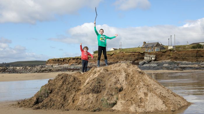 Brothers Fionn and Donncha Maloney playing king of the castle on Garrylucas Beach.  (Photo: David Creedon)