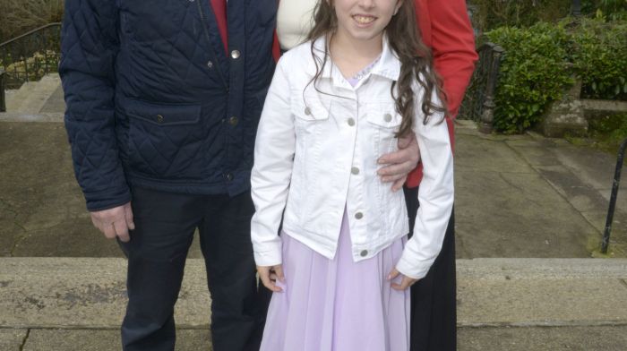 Ella Moloney with her grandparents Paddy and Maura Moloney at her Confirmation at St Patrick’s Church in Bandon.  (Photo: Denis Boyle)