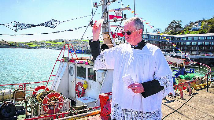 Fr. Robert Young, Parish Priest of Kinsale blessing the fleet at the annual Kinsale Sea Sunday commemoration.
Photo: John Allen