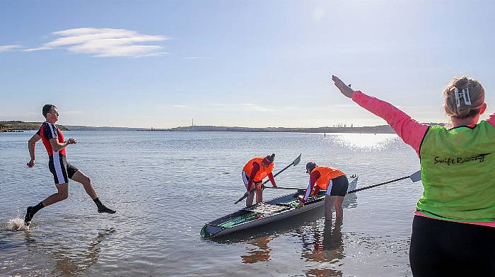 Davin Jennings of Kilmacsimon Rowing Club walks on water as he races to his boat at the start of the beach sprints at Passage West offshore rowing regatta that was held at Loughbeg, Ringaskiddy.   (Photo: David Creedon)