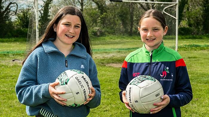 Siblings Faye and Kerri Gleeson from Ballineen were interested in the GAA club’s stand at the club day which was hosted by Beda last Saturday. (Photo: Andy Gibson)