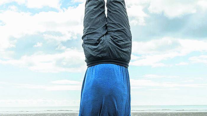 Instructor Cory Johnson at the mass yoga event at Inchydoney in aid of Breakthrough Cancer Research.  More than 100 people took part.      (Photo Andy Gibson)