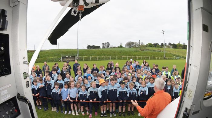 Colm Hillary from the Shannon-based Irish Coast Guard helicopter Rescue 115 speaking with pupils from Barryroe National School about safety.  (Photo: Martin Walsh)