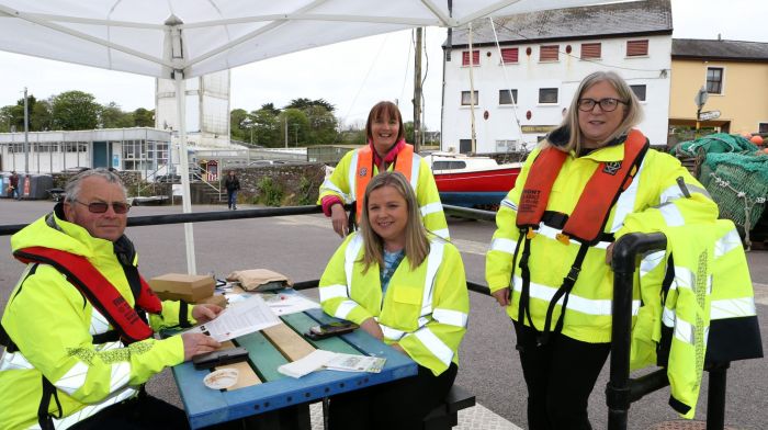 Diarmuid Minihane, Aoife Power, Noreen O' Mahony and Orla Chambers from Cork County Council welcomed passengers off the Seabourn Venture cruise ship when it visited Schull this week. (Photo: Carlos Benlayo)