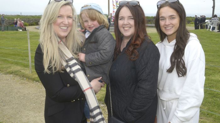 At the 107th commemoration of the sinking of the Lusitania at the Old Head of Kinsale were Maureen and Daniel  Blanchfield Finn with Margerat Hanrahan and Erin Hanrahan. Right: Sean O'Farrell, Courtmacsherry and Darragh Keating, Kinsale, of the RNLI, laying a wreath at the memorial. (Photos: Denis Boyle)