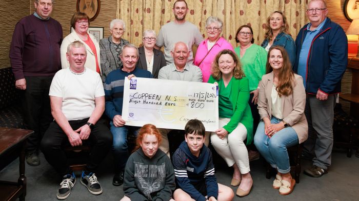 At the presentation of proceeds from Coppeen St Patrick's Day parade to Coppeen National School are (front, from left): Pat O'Driscoll (Castletown Ceili Dancers), Willie O'Mahony (Newcestown Comhaltas), Barry O'Sullivan (chair, Coppeen Community Council), Catherine Bradley (principal Coppeen National School) and Michelle Fox (Coppeen National School parents association) along with committee members and (seated, front) Alanna and Tomas O'Driscoll. (Photo: Therese Bourke)