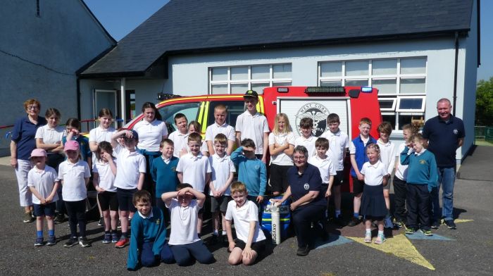 West Cork Rapid Response volunteers Betty Hennessy, Kate Crowley and Liam Slattery with the girls and boys from Rathbarry National School who were delighted to receive an informative visit during the week.