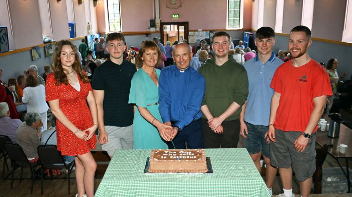 Reverend Kingsley Sutton and his wife Daphne cutting the cake to mark Rev. Kingsley’s 25th anniversary of his ordination to the priesthood.  Included are their children (left to right): Rosanna, Jonah, Matthew, Ralph and Harry.  Following service in Kilgarriffe Church, the reception took place in the parish hall. (Photo: Martin Walsh.)