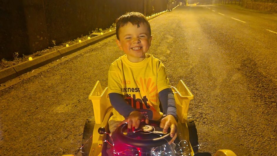 Young Elijah Cunningham was up early to get proceedings started at Drinagh's Darkness into Light walk on Saturday morning.